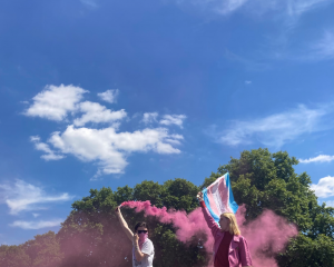 Trans flag and pink powder in the sky
