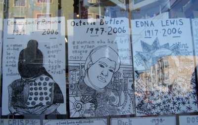 Window in the city with three posters in a row with three African Americans activists 